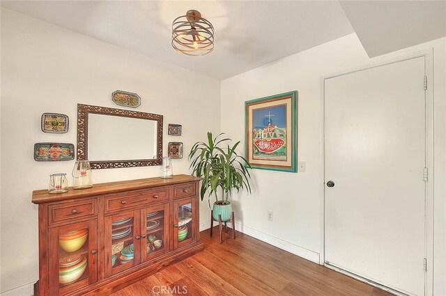 1531 Corte Caballo Unit 33, Upland, CA 91786 - sitting room featuring wood finished floors and baseboards
