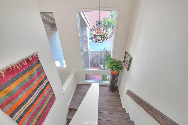 1531 Corte Caballo Unit 33, Upland, CA 91786 - entrance foyer featuring a chandelier and wood finished floors