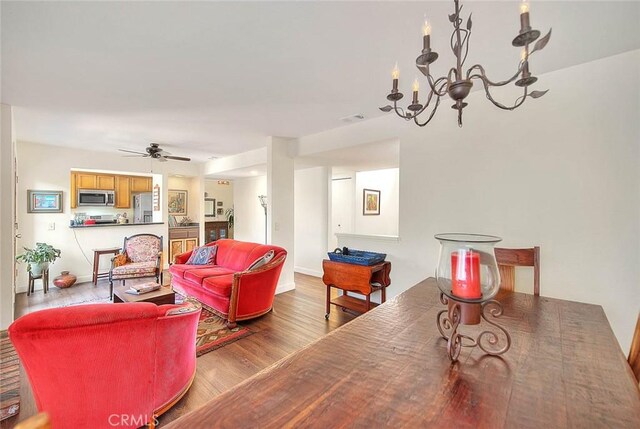 1531 Corte Caballo Unit 33, Upland, CA 91786 - living room with wood finished floors, a chandelier, and ceiling fan