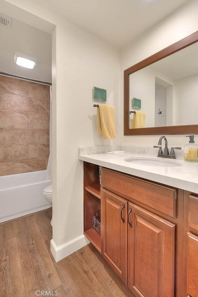 1531 Corte Caballo Unit 33, Upland, CA 91786 - bathroom with vanity, wood finished floors, and  shower combination