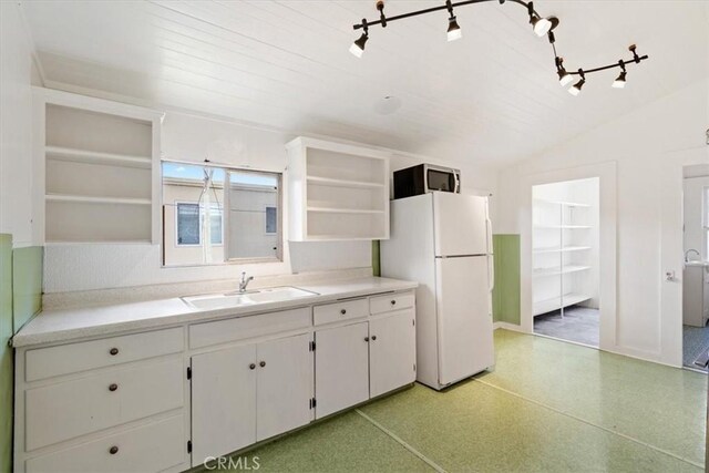 863 Chorro St, San Luis Obispo, CA 93401 - kitchen with open shelves, freestanding refrigerator, light countertops, lofted ceiling, and white cabinetry