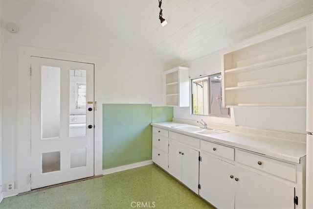 863 Chorro St, San Luis Obispo, CA 93401 - kitchen with open shelves, white cabinets, light countertops, and light flooring