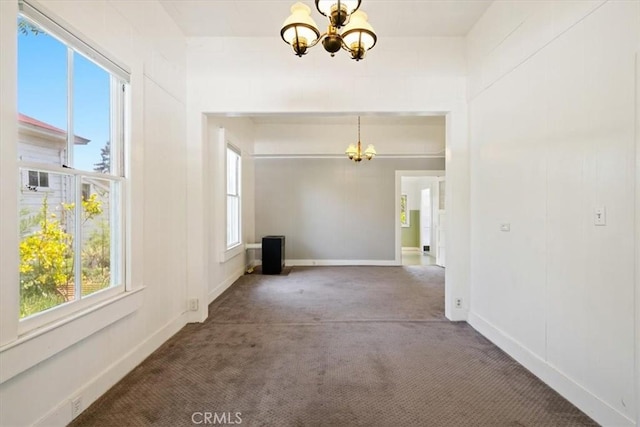 863 Chorro St, San Luis Obispo, CA 93401 - carpeted spare room featuring a chandelier