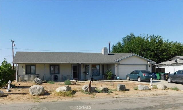 8372 Dogwood Ave, California City, CA 93505 - single story home featuring a porch, an attached garage, a chimney, and concrete driveway
