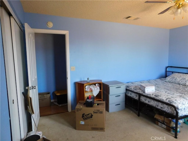 8372 Dogwood Ave, California City, CA 93505 - bedroom with carpet floors, a textured ceiling, a closet, and a ceiling fan