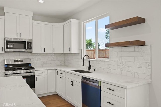 1761 Drayer Dr, Paradise, CA 95969 - kitchen featuring appliances with stainless steel finishes, open shelves, white cabinetry, light stone counters, and recessed lighting
