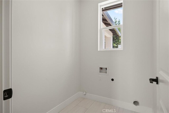 1761 Drayer Dr, Paradise, CA 95969 - laundry area with hookup for an electric dryer, washer hookup, and light tile patterned floors