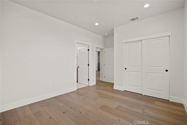 1761 Drayer Dr, Paradise, CA 95969 - unfurnished bedroom featuring wood finished floors, recessed lighting, and a closet