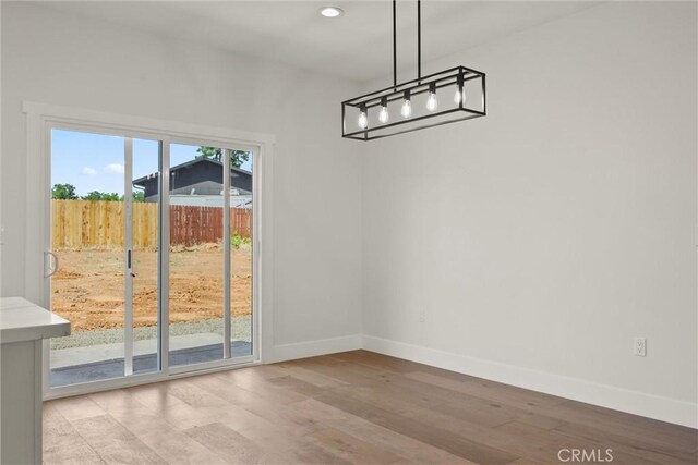 1761 Drayer Dr, Paradise, CA 95969 - unfurnished dining area featuring light wood finished floors, recessed lighting, and a chandelier