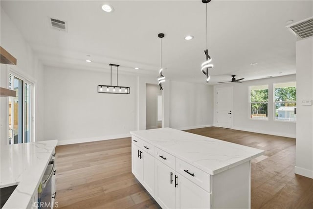 1761 Drayer Dr, Paradise, CA 95969 - kitchen with recessed lighting, light wood finished floors, ceiling fan, pendant lighting, and open floor plan