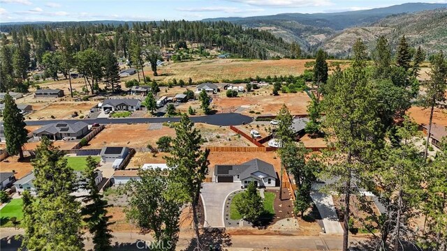 1761 Drayer Dr, Paradise, CA 95969 - aerial overview of property's location with nearby suburban area and a mountain backdrop
