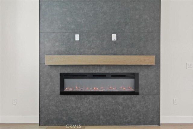1761 Drayer Dr, Paradise, CA 95969 - detailed view of a glass covered fireplace and wood finished floors
