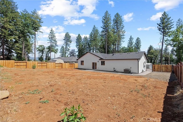 1761 Drayer Dr, Paradise, CA 95969 - rear view of house featuring a fenced backyard, a patio, and stucco siding