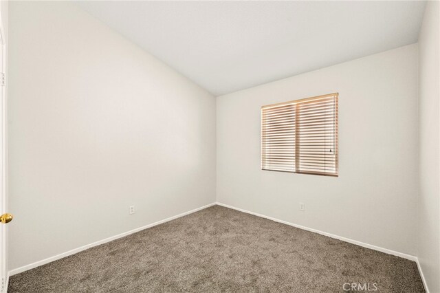 33546 Maplewood Ct, Temecula, CA 92592 - carpeted empty room with baseboards and vaulted ceiling