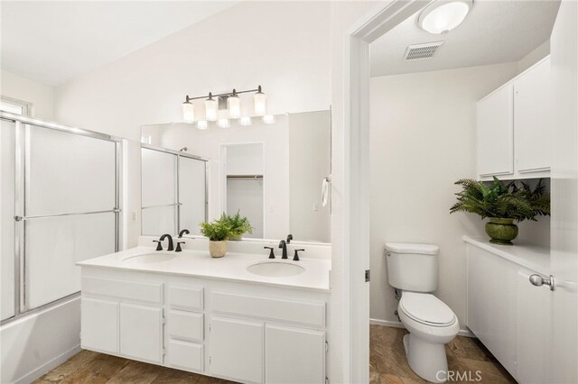 33546 Maplewood Ct, Temecula, CA 92592 - bathroom featuring double vanity and enclosed tub / shower combo