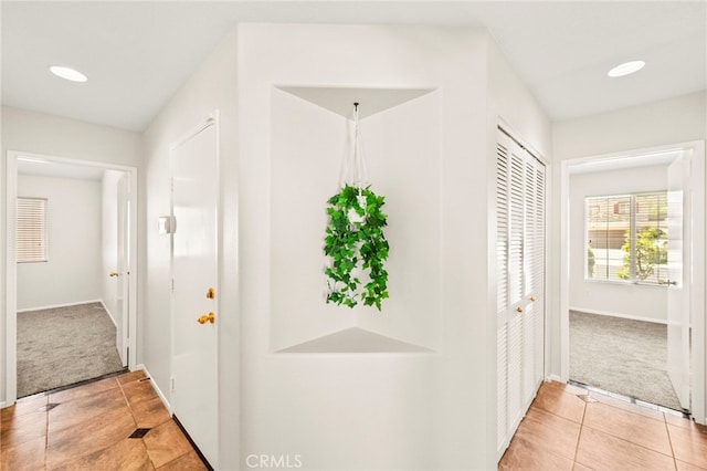 33546 Maplewood Ct, Temecula, CA 92592 - hallway featuring light tile patterned floors, light carpet, and recessed lighting