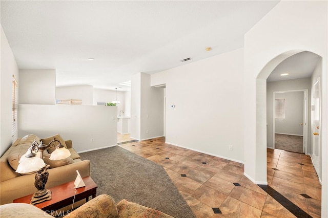 33546 Maplewood Ct, Temecula, CA 92592 - living area featuring arched walkways, recessed lighting, and tile patterned floors