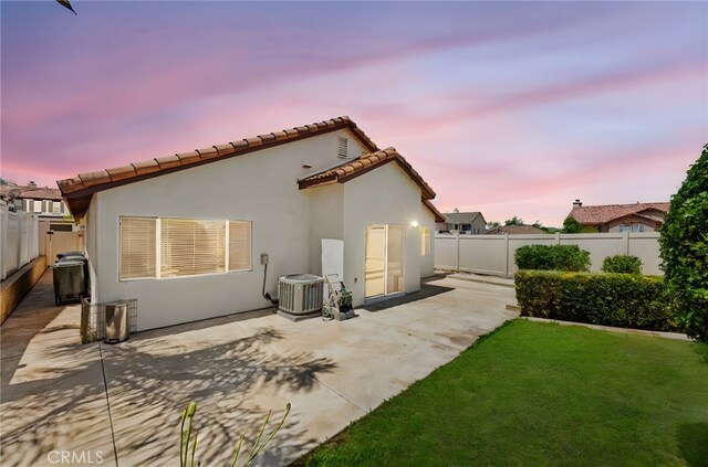 33546 Maplewood Ct, Temecula, CA 92592 - rear view of property featuring a fenced backyard, a patio, stucco siding, and a tiled roof