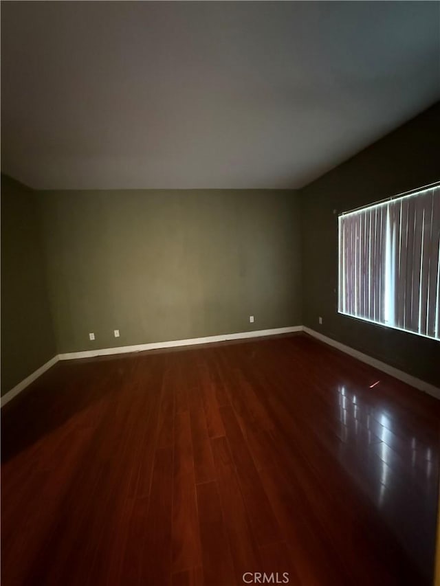 13590 Fox Point Rd, Victorville, CA 92392 - unfurnished room with dark wood-style floors and baseboards
