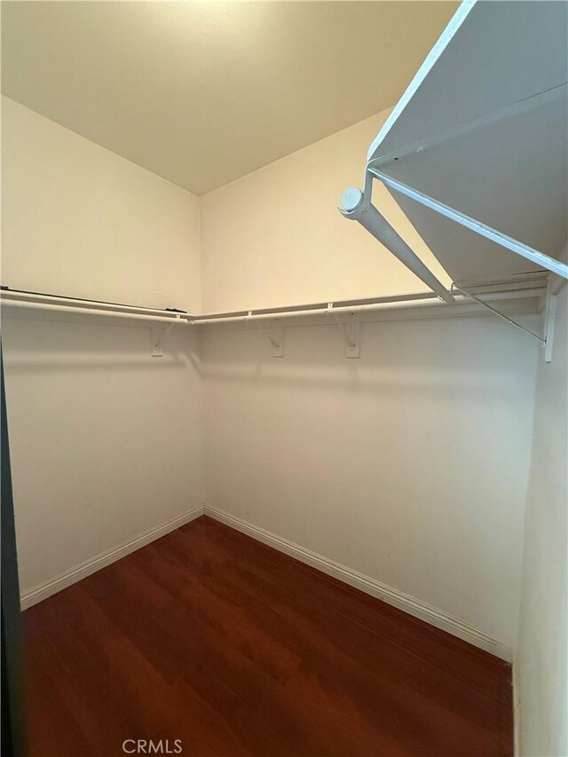 13590 Fox Point Rd, Victorville, CA 92392 - spacious closet featuring dark wood-style floors