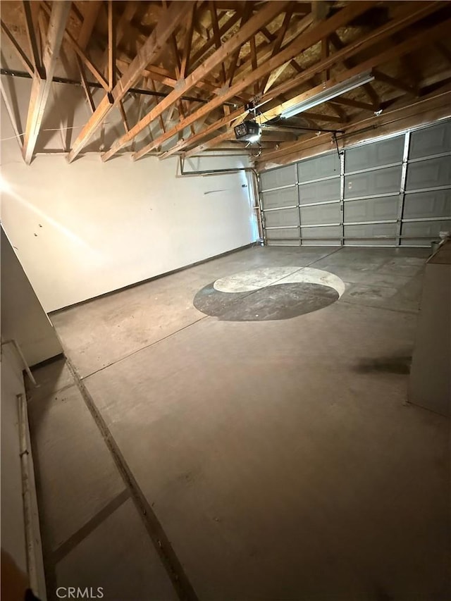 13590 Fox Point Rd, Victorville, CA 92392 - garage featuring a garage door opener