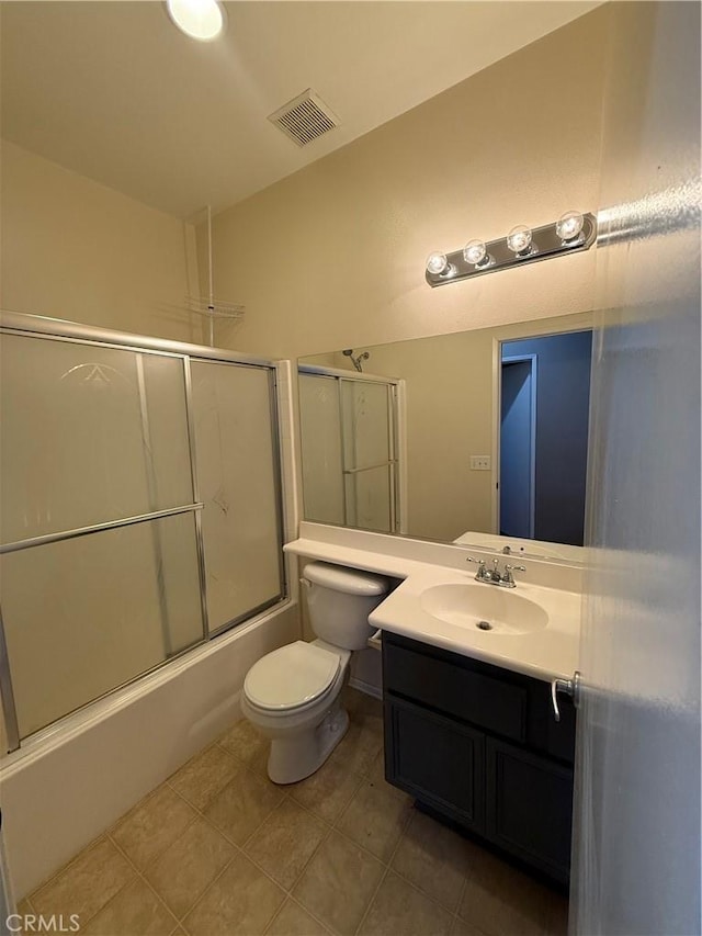 13590 Fox Point Rd, Victorville, CA 92392 - full bath featuring vanity, shower / bath combination with glass door, and tile patterned floors