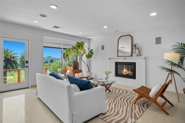4698 Morro Dr, Woodland Hills, CA 91364 - living area featuring light tile patterned flooring, recessed lighting, and a glass covered fireplace
