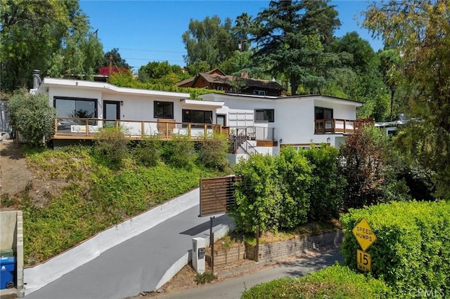4698 Morro Dr, Woodland Hills, CA 91364 - back of house with stucco siding and stairway