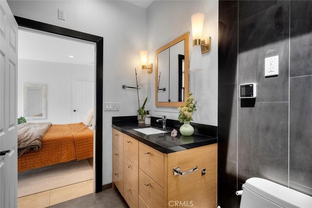 4698 Morro Dr, Woodland Hills, CA 91364 - ensuite bathroom with vanity and tile patterned floors