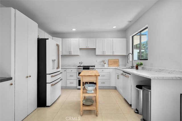 4698 Morro Dr, Woodland Hills, CA 91364 - kitchen with white appliances, recessed lighting, white cabinets, and light tile patterned floors