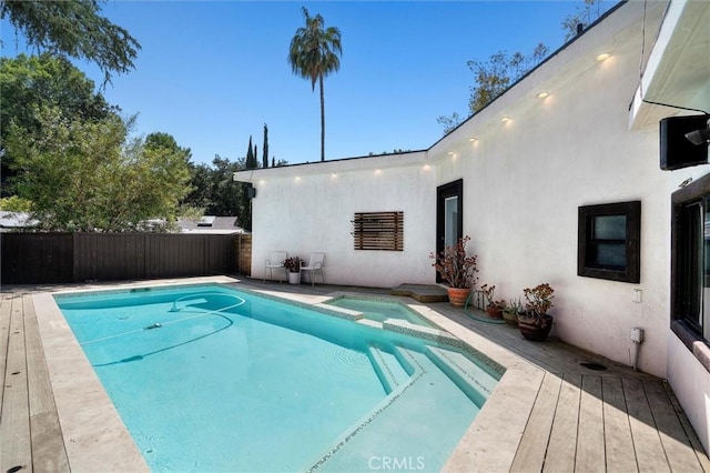 4698 Morro Dr, Woodland Hills, CA 91364 - view of swimming pool with a pool with connected hot tub and a wooden deck