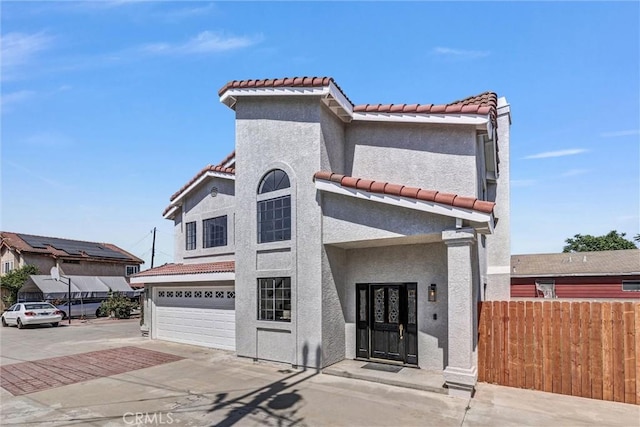10102 Rio Hondo, El Monte, CA 91733 - mediterranean / spanish-style home featuring a tiled roof, an attached garage, stucco siding, and concrete driveway
