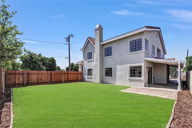 10102 Rio Hondo, El Monte, CA 91733 - back of property featuring stucco siding, a fenced backyard, a patio, and a chimney