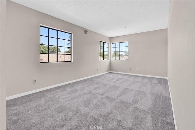 10102 Rio Hondo, El Monte, CA 91733 - carpeted empty room featuring baseboards and a textured ceiling