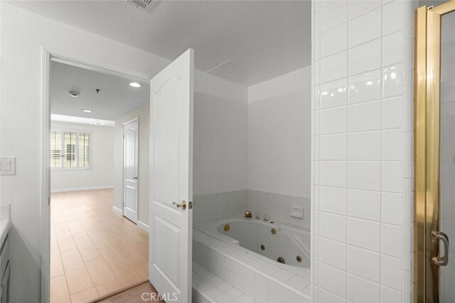 4348 Mammoth Ave Unit 102, Sherman Oaks, CA 91423 - full bath featuring a tub with jets, vanity, and recessed lighting