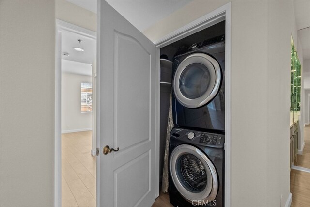4348 Mammoth Ave Unit 102, Sherman Oaks, CA 91423 - laundry area with estacked washer and dryer and wood finished floors