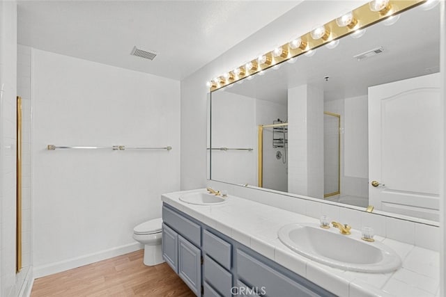 4348 Mammoth Ave Unit 102, Sherman Oaks, CA 91423 - full bathroom featuring wood finished floors, double vanity, and a shower stall