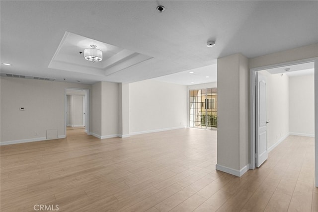4348 Mammoth Ave Unit 102, Sherman Oaks, CA 91423 - empty room with a pendent fire sprinkler, light wood finished floors, a tray ceiling, recessed lighting, and a smoke detector