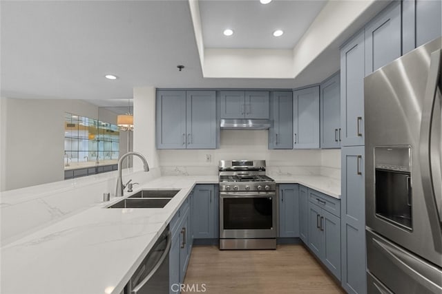4348 Mammoth Ave Unit 102, Sherman Oaks, CA 91423 - kitchen featuring appliances with stainless steel finishes, light stone countertops, recessed lighting, light wood-style flooring, and gray cabinetry