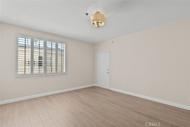 4348 Mammoth Ave Unit 102, Sherman Oaks, CA 91423 - empty room with wood finished floors and fire sprinkler in ceiling