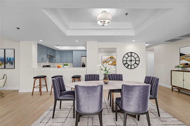 4348 Mammoth Ave Unit 102, Sherman Oaks, CA 91423 - dining room featuring light wood finished floors, a raised ceiling, and recessed lighting