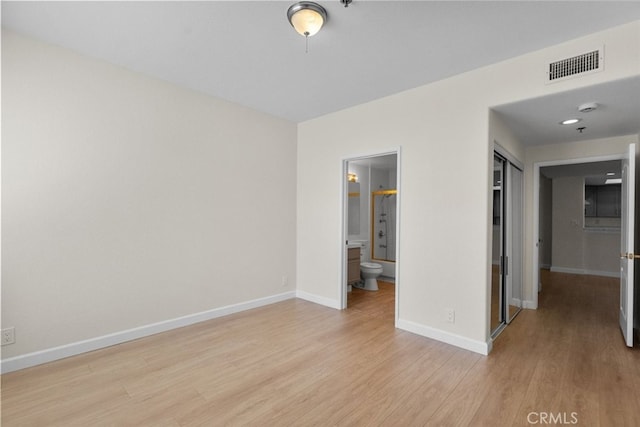 4348 Mammoth Ave Unit 102, Sherman Oaks, CA 91423 - unfurnished bedroom featuring light wood-style floors, ensuite bathroom, and a closet