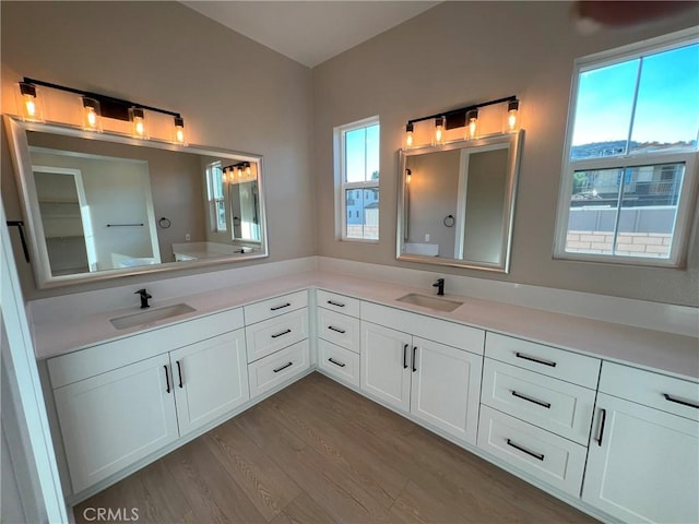 22046 Fig Tree Ln, Chatsworth, CA 91311 - bathroom with double vanity and wood finished floors