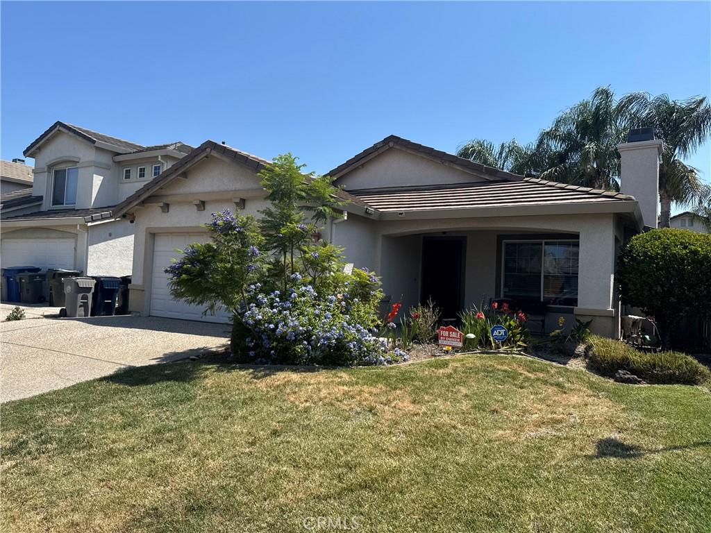 5330 Alvoca Way, Sacramento, CA 95835 - ranch-style home featuring stucco siding, concrete driveway, and a front lawn