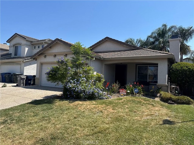 5330 Alvoca Way, Sacramento, CA 95835 - ranch-style home featuring stucco siding, concrete driveway, and a front lawn