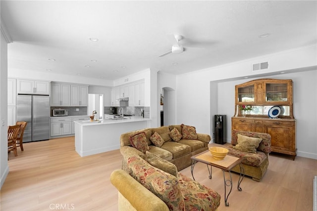 4324 Park Verdi, Calabasas, CA 91302 - living room featuring light wood-style flooring, a ceiling fan, recessed lighting, and arched walkways