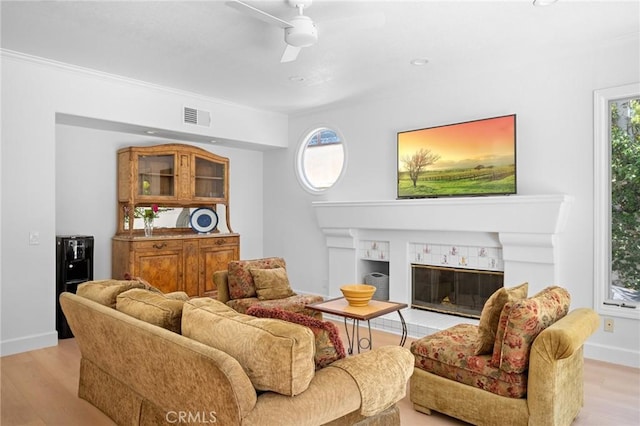 4324 Park Verdi, Calabasas, CA 91302 - living area with a ceiling fan, light wood-style floors, a glass covered fireplace, crown molding, and recessed lighting