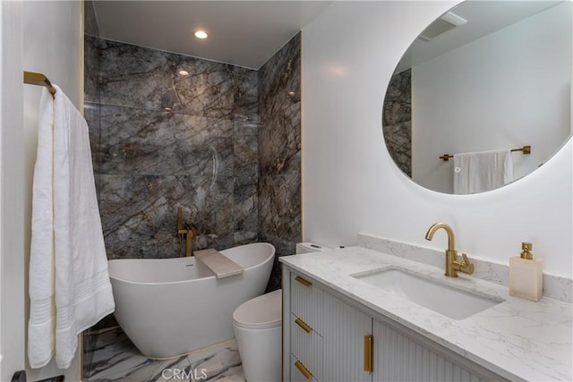 9418 Via Patricia Unit 30, Burbank, CA 91504 - full bathroom with marble tiled floors, a freestanding bath, vanity, and recessed lighting