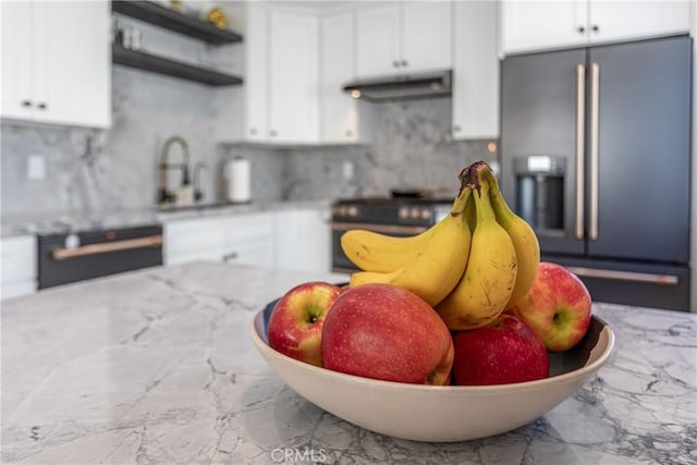 9418 Via Patricia Unit 30, Burbank, CA 91504 - kitchen with high quality fridge, under cabinet range hood, marble tiled floors, and stove