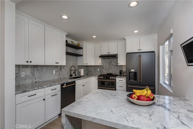 9418 Via Patricia Unit 30, Burbank, CA 91504 - kitchen featuring high quality appliances, under cabinet range hood, open shelves, white cabinetry, and backsplash